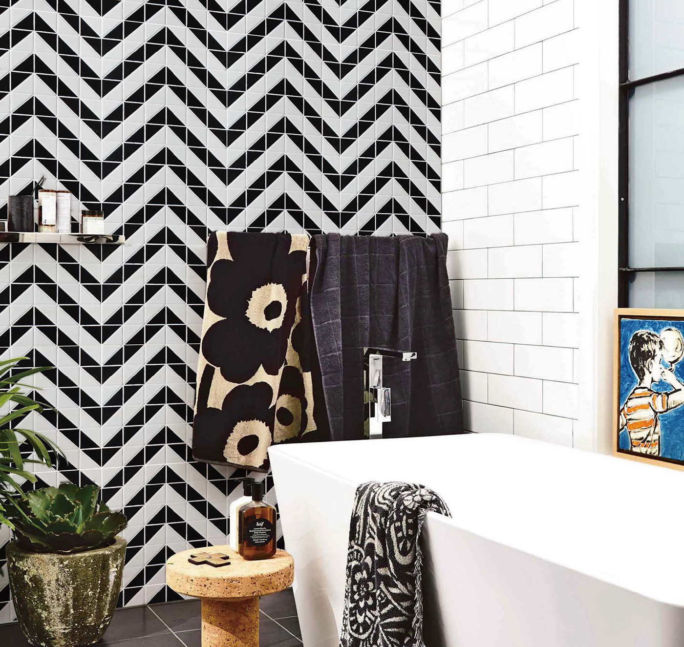 Bathroom with bold pattern, triangle mosaic tiles, artistic tile design