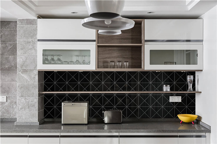 Glossy black triangle tiled kitchen backsplash