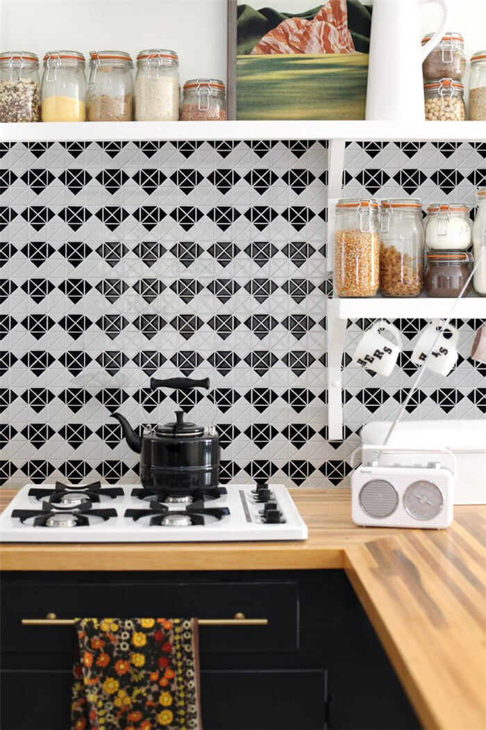 Black and white diamond tile for dramatic kitchen backsplash